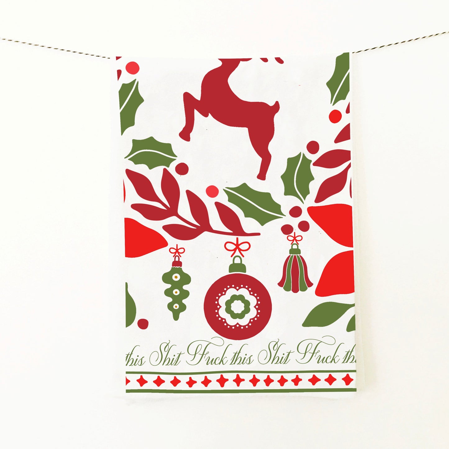 kitchen towel with deer and ornaments christmas themed and says fuck this shit around the border