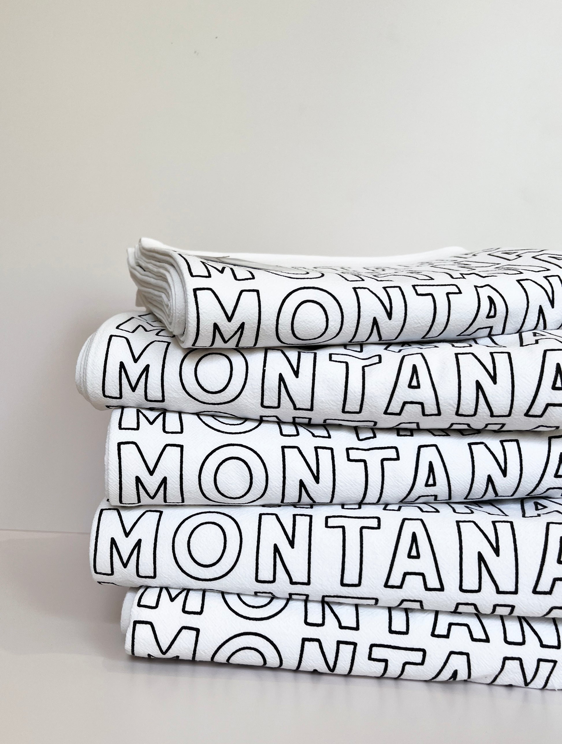 pretty montana theme tea towel screen printed typography spelling montana on cotton kitchen towel western home decor decorative montana gifts montana wedding favors coin laundry fun funny snarky home decor gifts