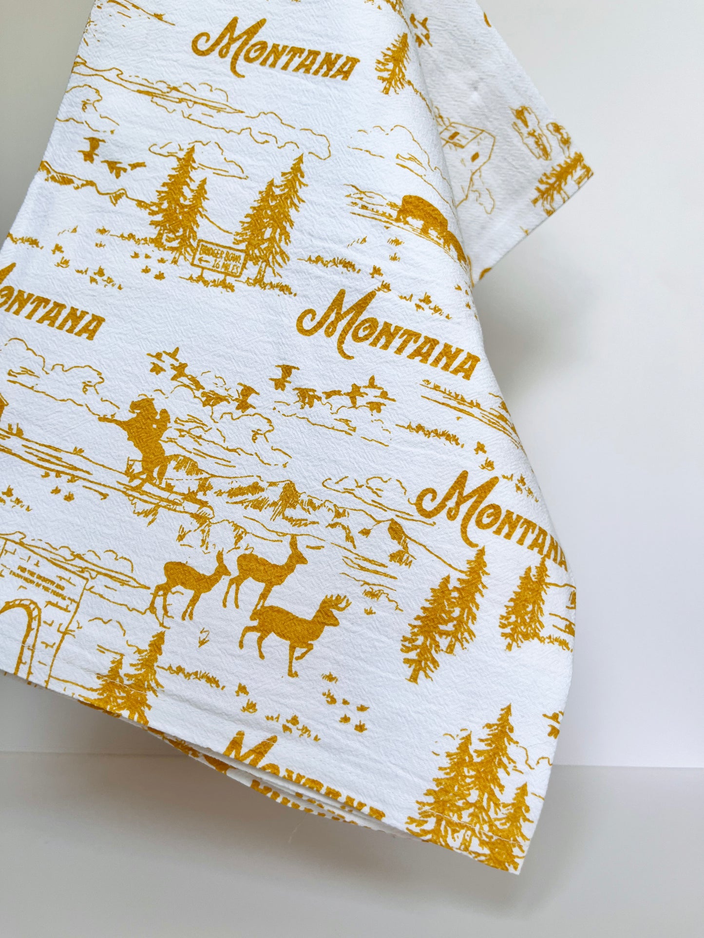 cute montana kitchen towel various scenes cowgirl cowboy elk deer pine trees bison mountains big sky birds yellowstone grain elevator ranch souvenir from montana coin laundry pretty cotton dish towels