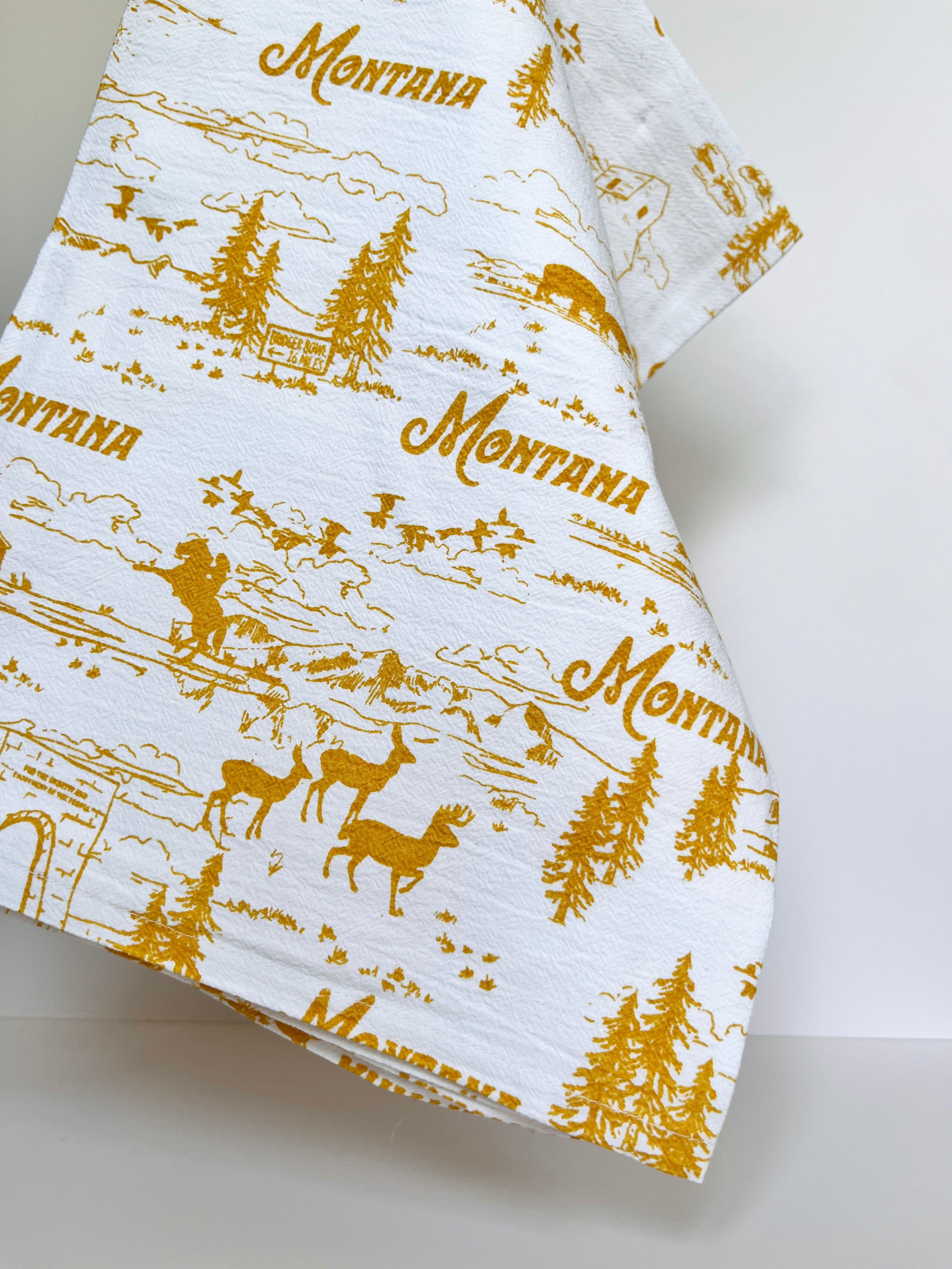 cute montana kitchen towel various scenes cowgirl cowboy elk deer pine trees bison mountains big sky birds yellowstone grain elevator ranch souvenir from montana coin laundry pretty cotton dish towels