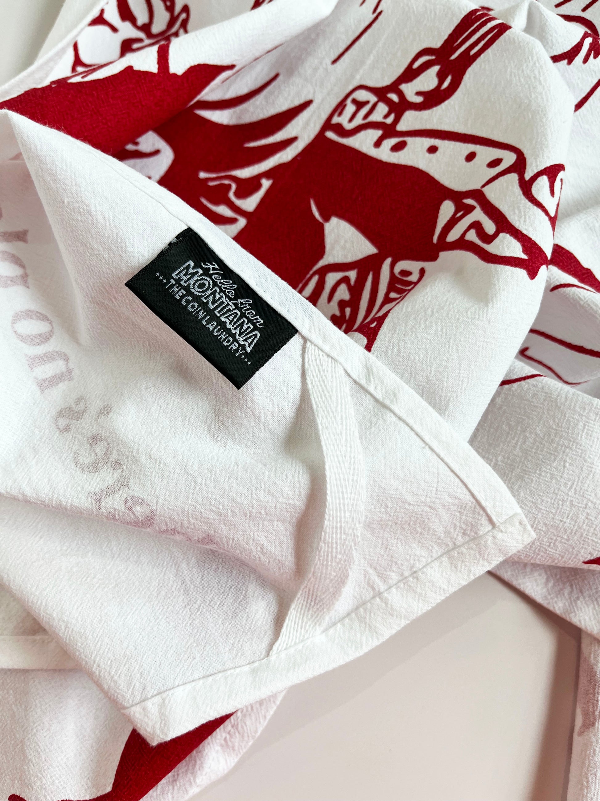 theres no place like montana cowgirl riding horse screen printed cotton tea towel red burgundy print fun kitchen towels coin laundry montana