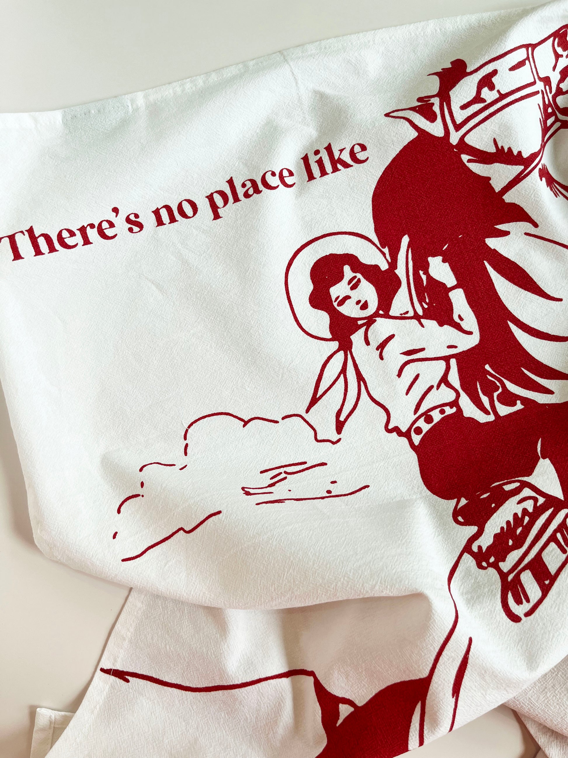 red screen printed cotton kitchen towel theres no place like montana cowgirl riding horse mountains sky clouds fun western home decor coin laundry montana