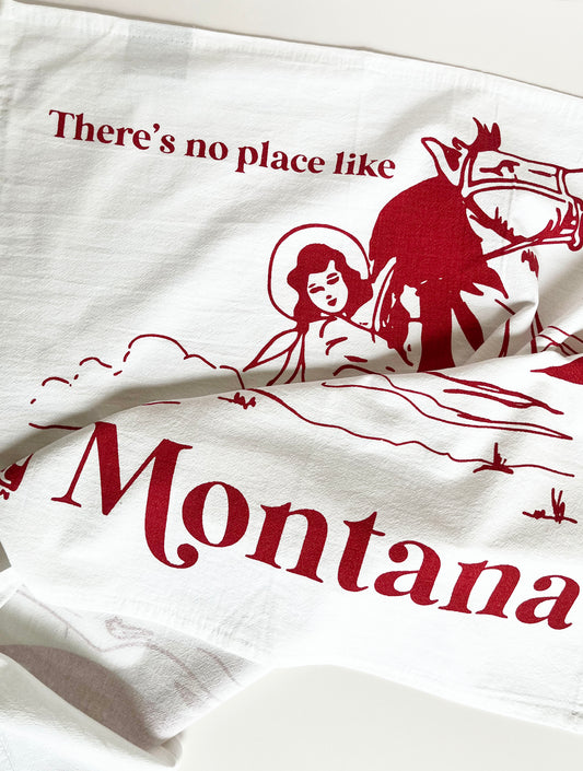 dish towel cowgirl riding horse mountains there's no place like Montana cotton kitchen towel screen print red ink coin laundry montana