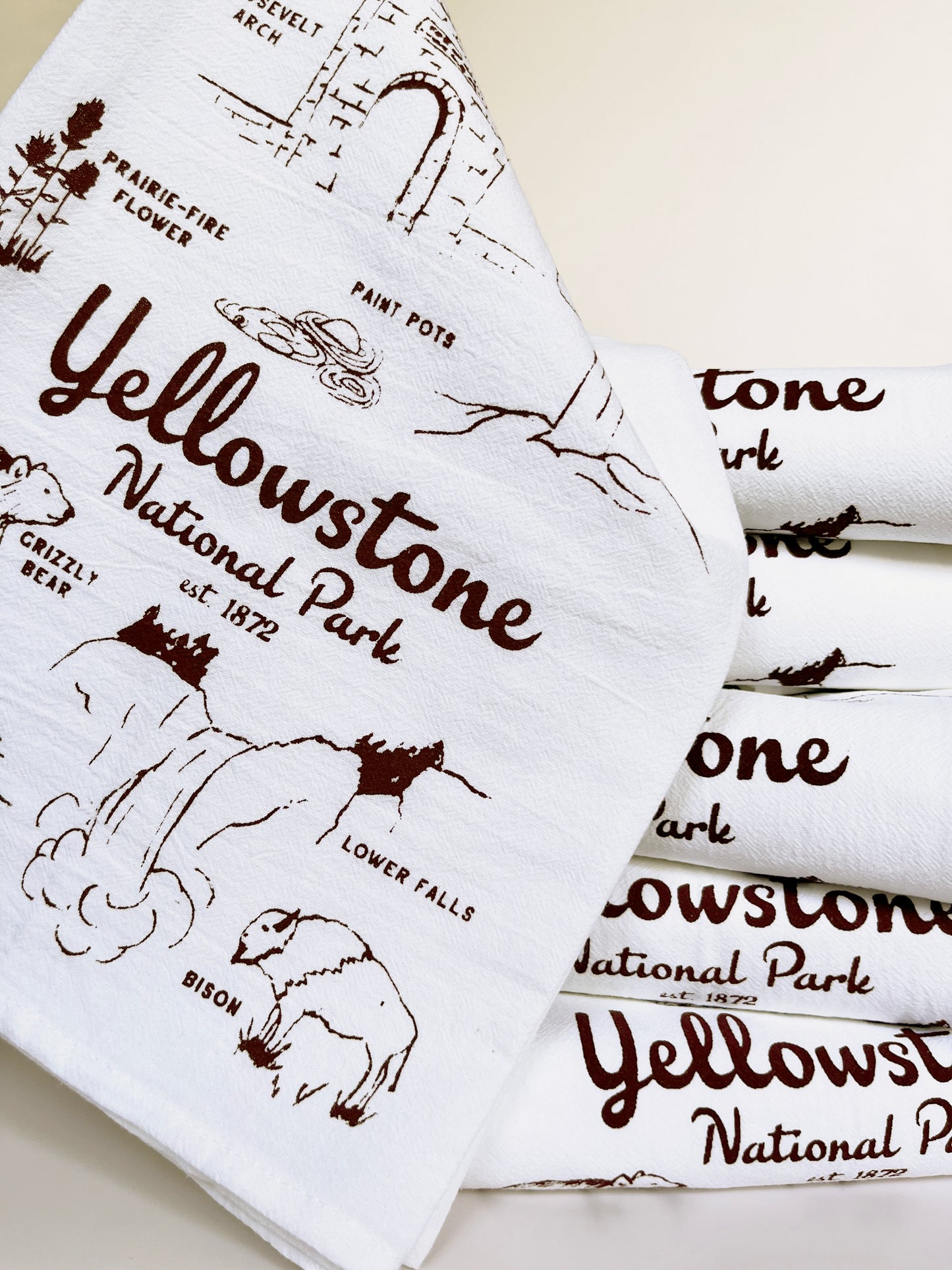 cotton dish towel yellowstone national park screen print brown ink hand drawn illustrations of bear bison waterfalls old faithful flowers Roosevelt arch souvenir tea towel fun screen print towels coin laundry montana