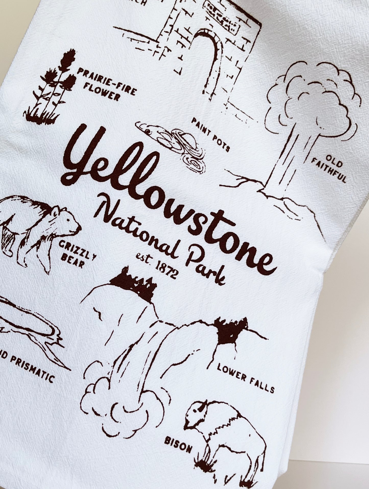 cotton dish towel with yellowstone national park scenes animals geysers waterfalls bears bison buffalo screen printed souvenir towel fun screen printed towels coin laundry montana