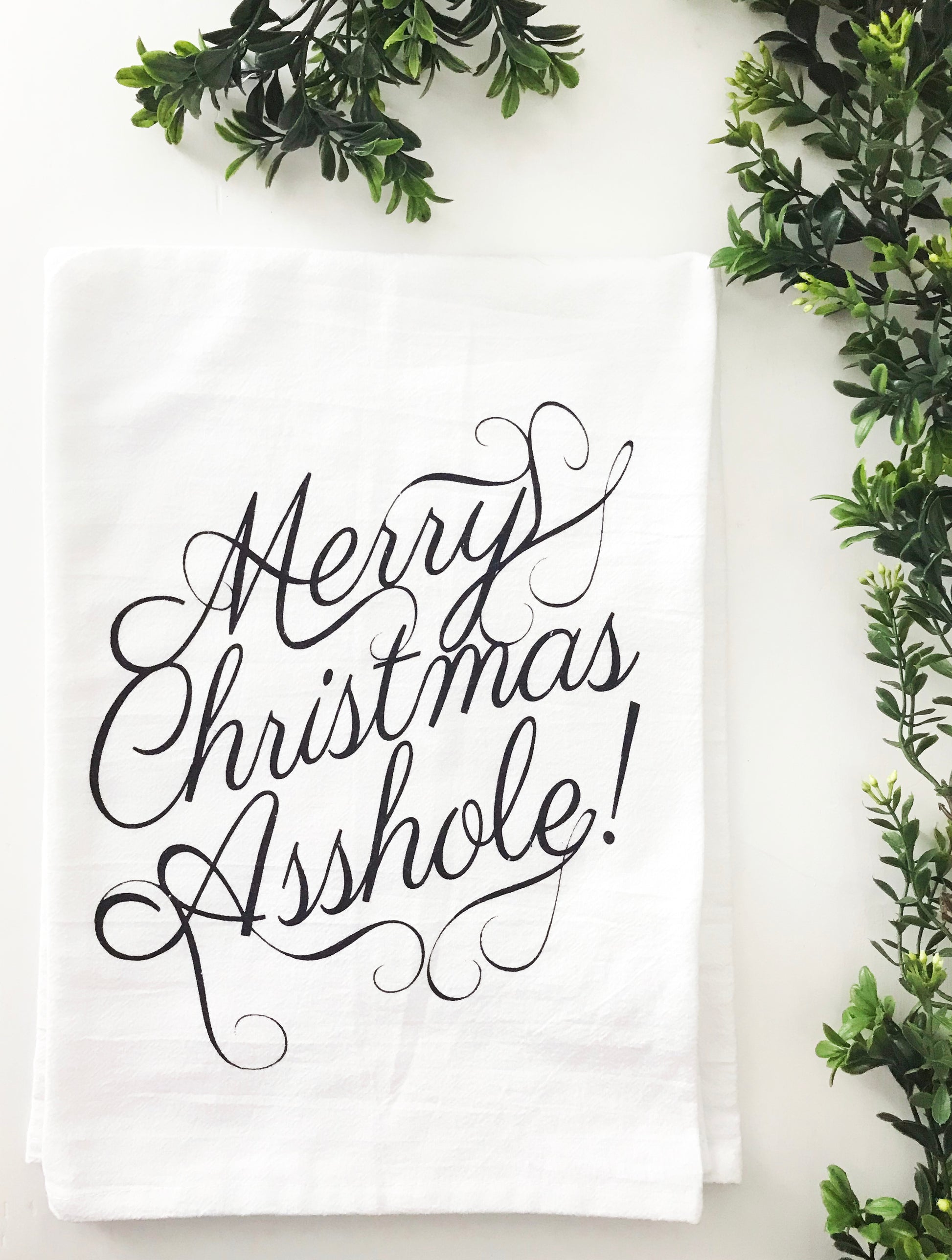 merry christmas asshole written in pretty cursive writing on cotton dish towel funny christmas home decor black and white screen print modern classic home decor coin laundry montana