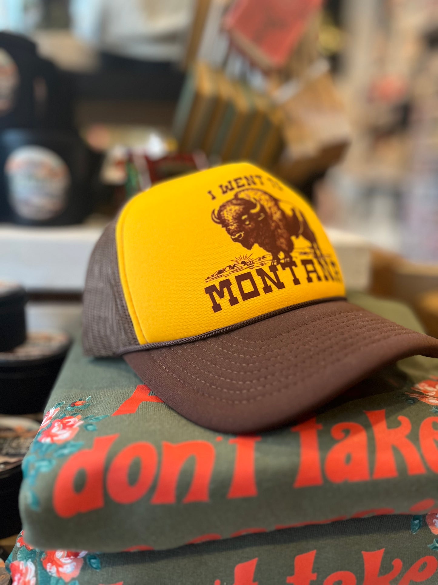 Yellow and brown cap with 'I Went to Montana' text 