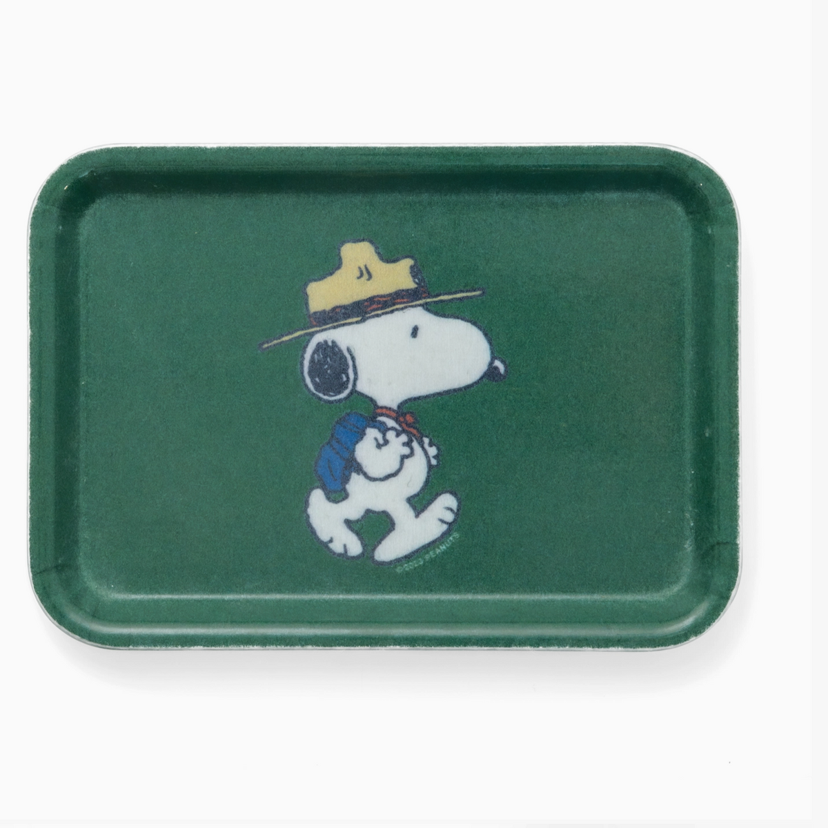 A green rectangular tray featuring a printed illustration of Snoopy wearing a yellow hat and blue backpack, shown on a plain white background.