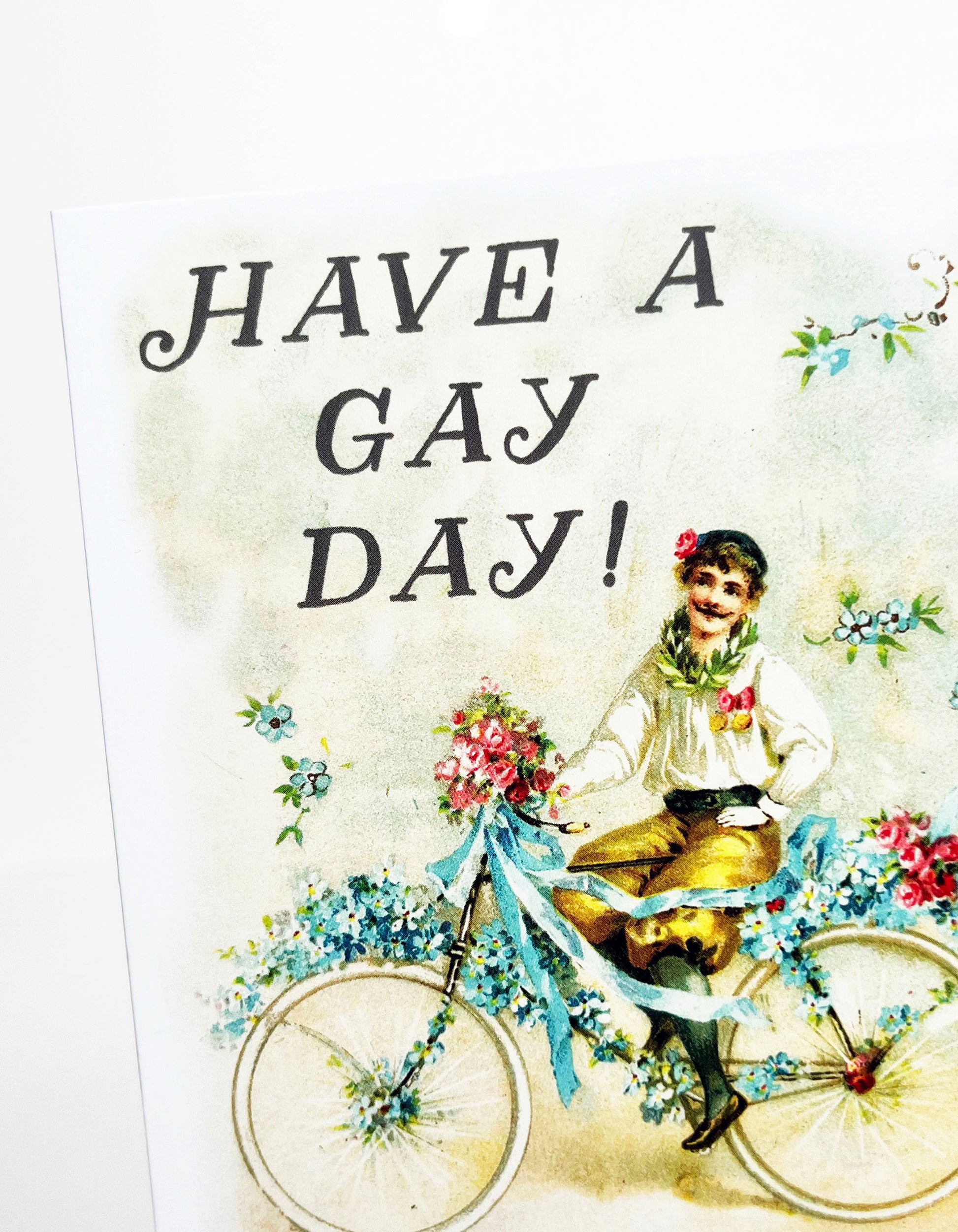 have a gay day greeting card vintage inspired man boy on bicycle bike floral flowers fancy pantaloons fabulous lgbtq+ queer nonbinary just because birthday wedding engagement new baby new home housewarming anniversary coin laundry blank inside