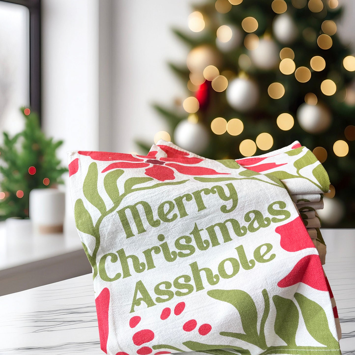 Merry Christmas Asshole towel with a festive background