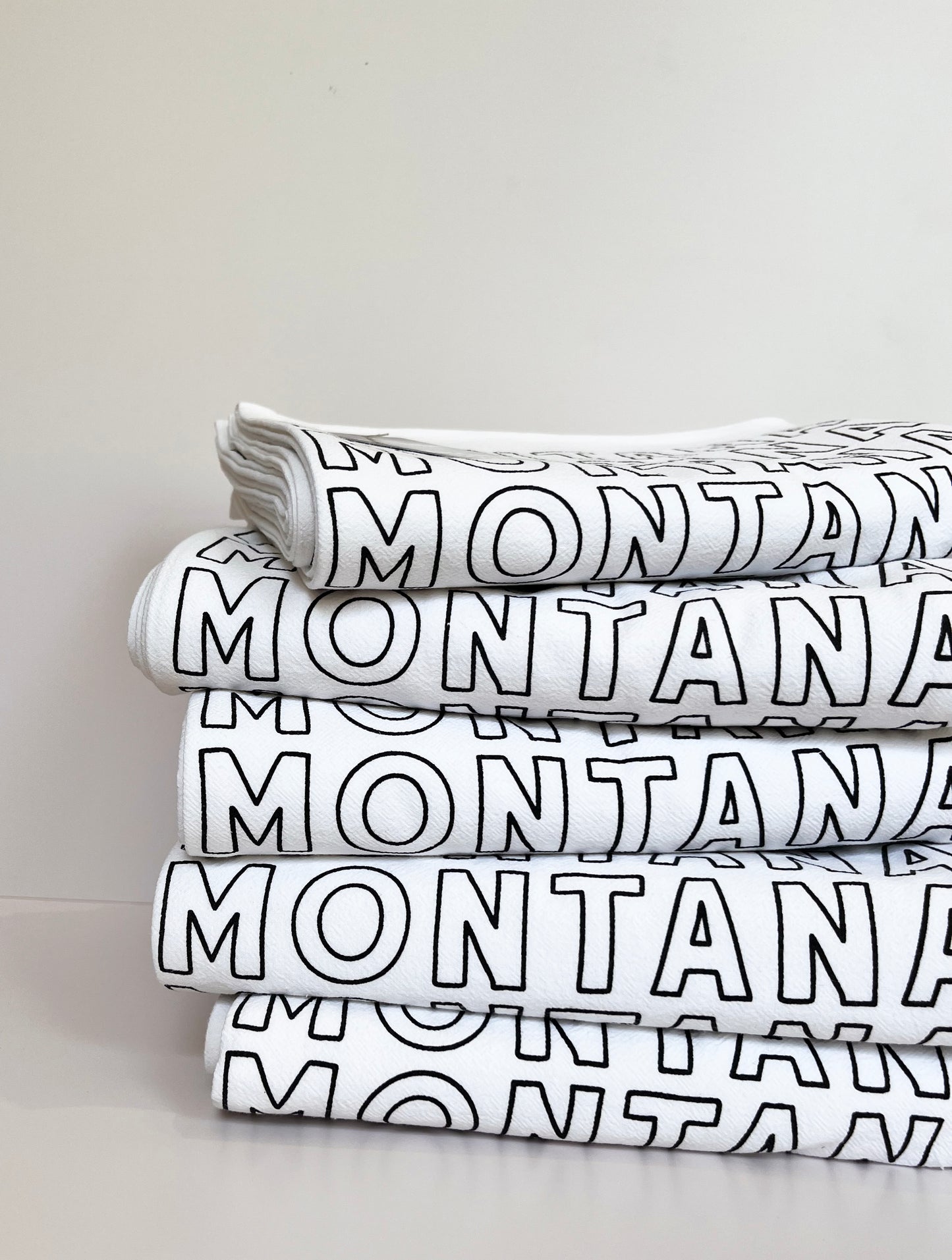 pretty montana theme tea towel screen printed typography spelling montana on cotton kitchen towel western home decor decorative montana gifts montana wedding favors coin laundry fun funny snarky home decor gifts 