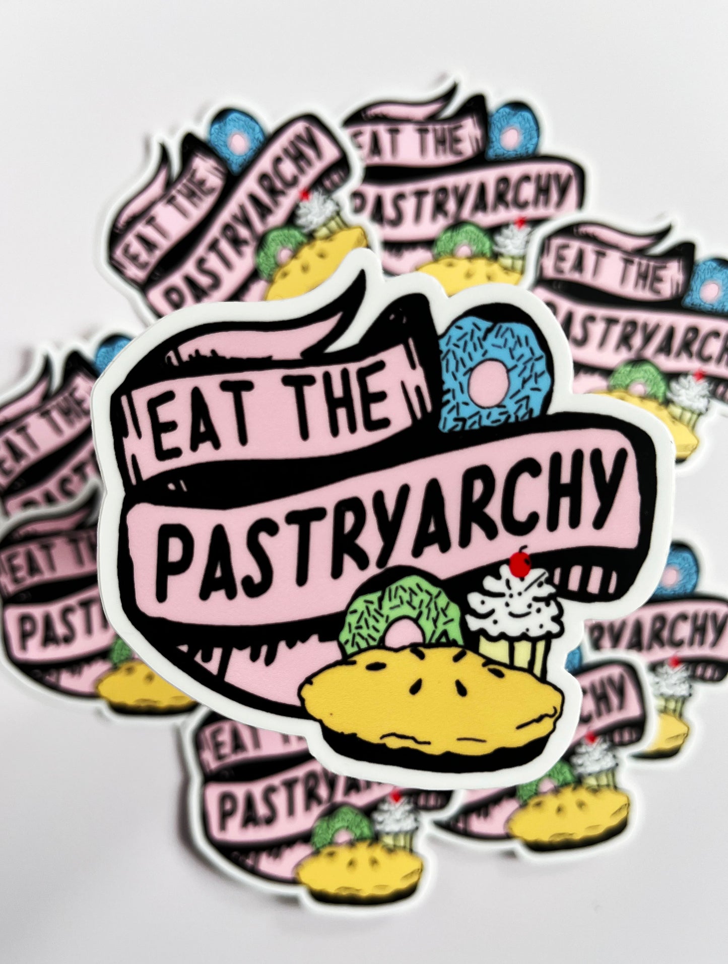 funny vinyl sticker says eat the pastryarchy joke anti patriarchy feminist baked goods fun sticker decal coin laundry montana
