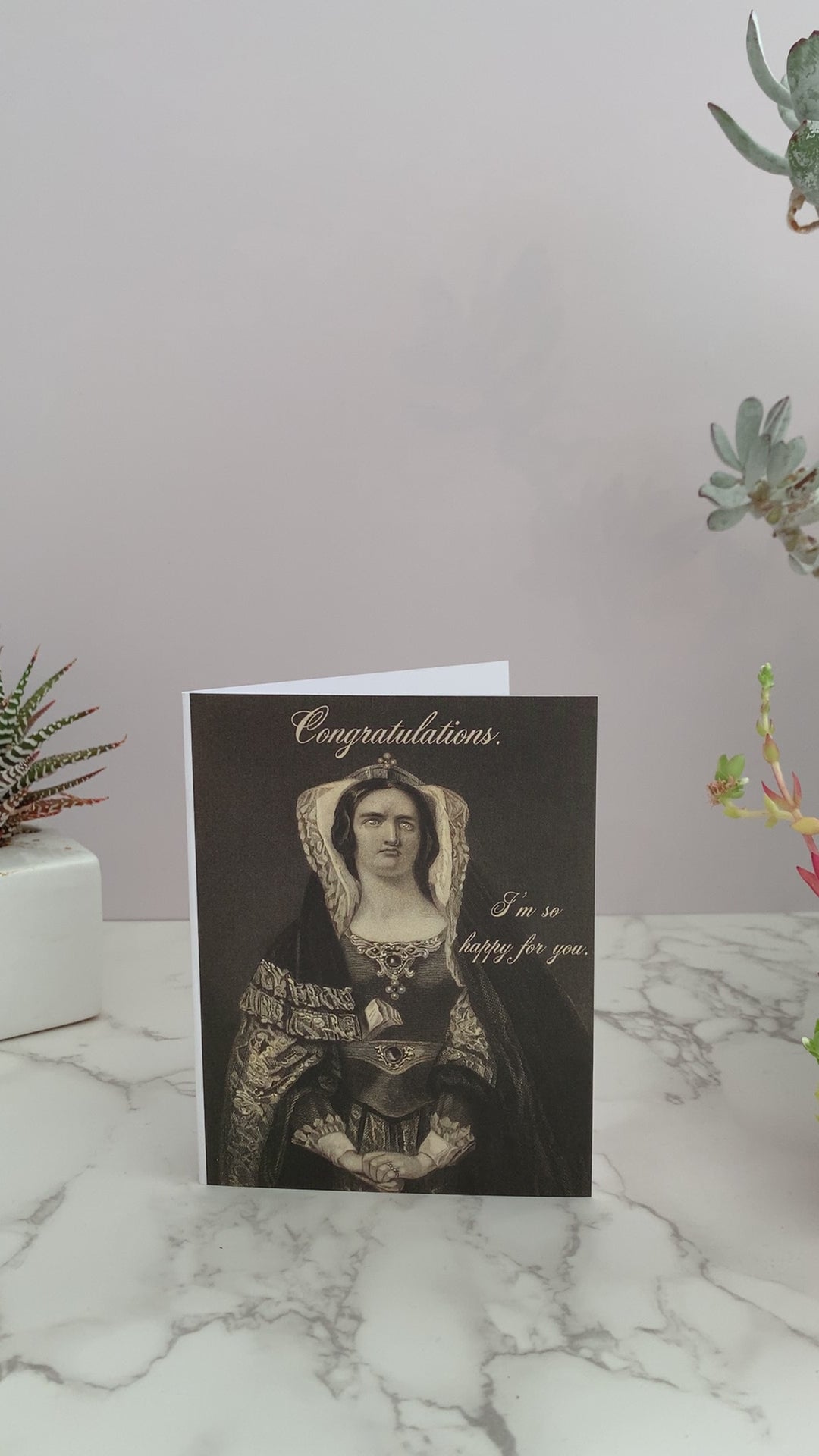 All purpose greeting card that says "Congratulations. I'm so happy for you." on the front. Color is shades of black and cream. Features a vintage image of a woman, extravagantly dressed, with a vacant stare. coin laundry  