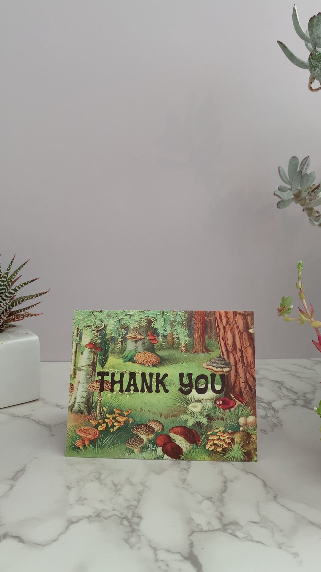 Cute Thank You greeting card. Vintage forrest scene with trees and mushrooms. Greeting on the front of the card says Thank you. Blank inside. 