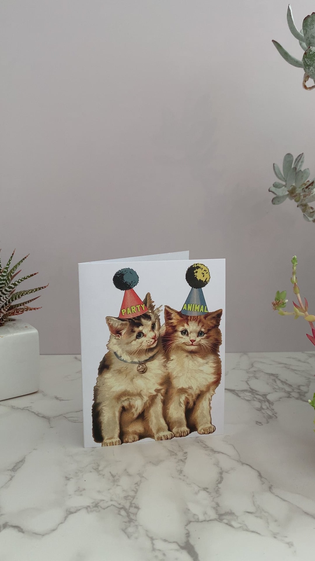 Greeting card with vintage kitties wearing party hats. One hat says, "Party" and the other hat says "Animal." Great for any occasion, birthdays, anniversaries, celebrations, or just because. Blank inside. 
