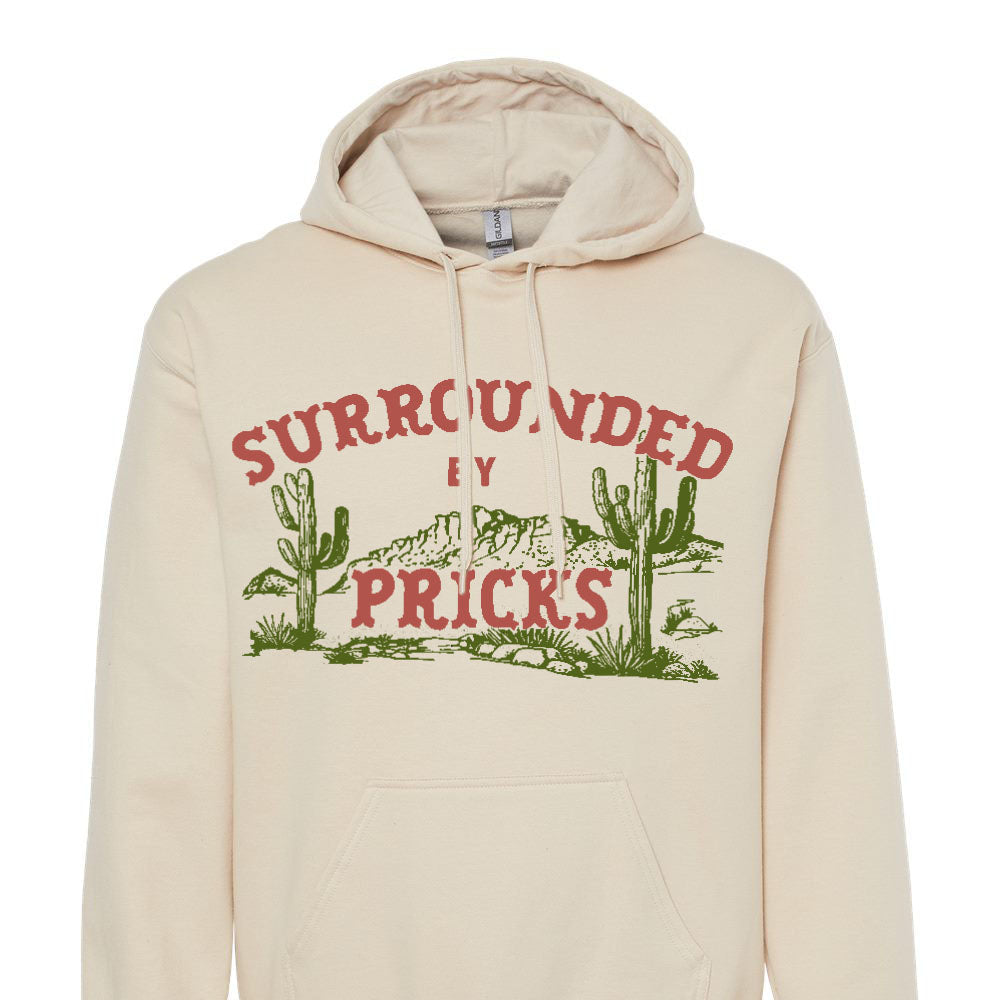Beige hoodie with graphic design and surrounded by pricks text on a white background