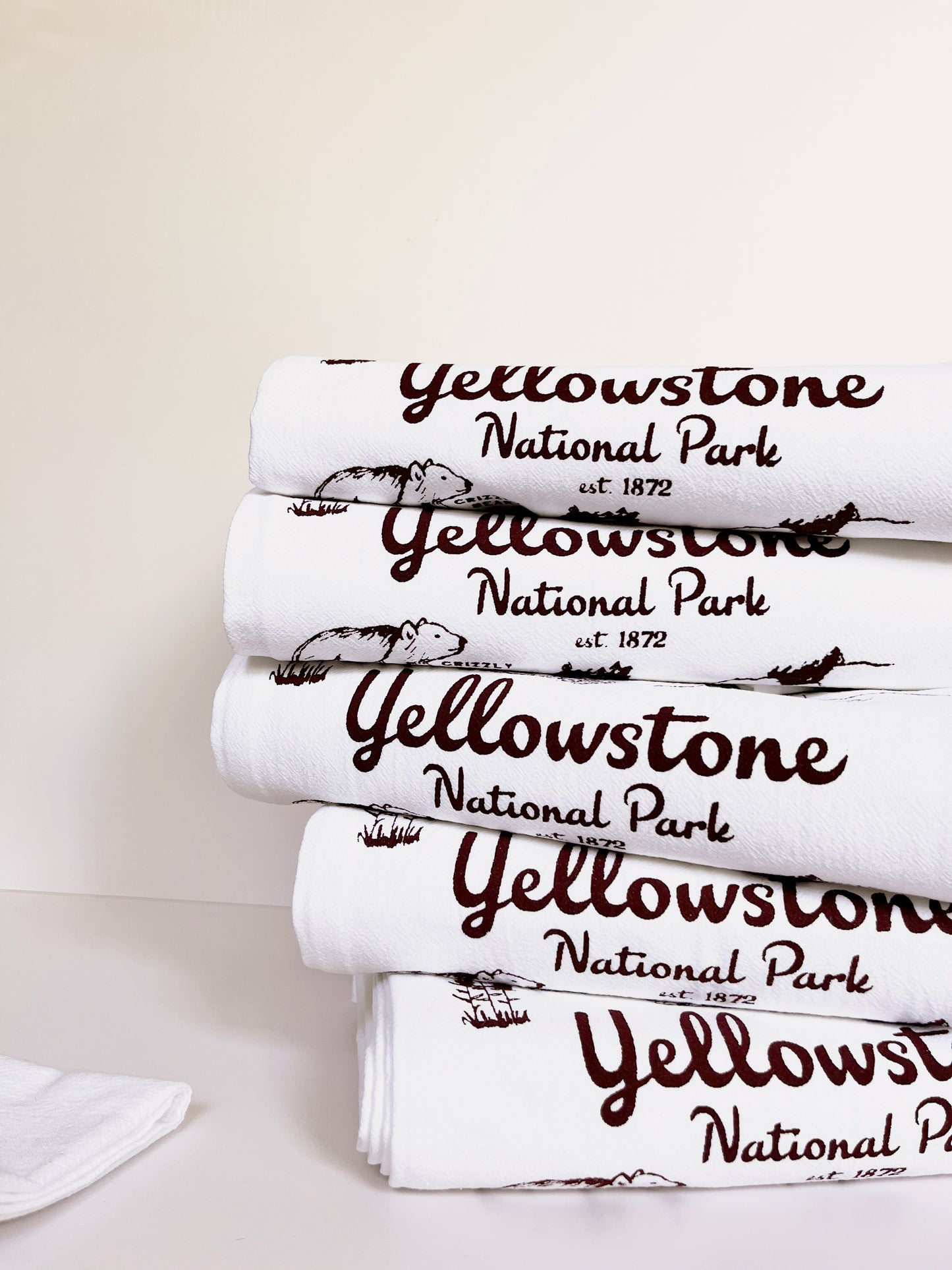 cute yellowstone national park souvenir cotton kitchen towel retro style screen print hand drawn illustrations bear old faithful montana wyoming travel fun towels coin laundry montana