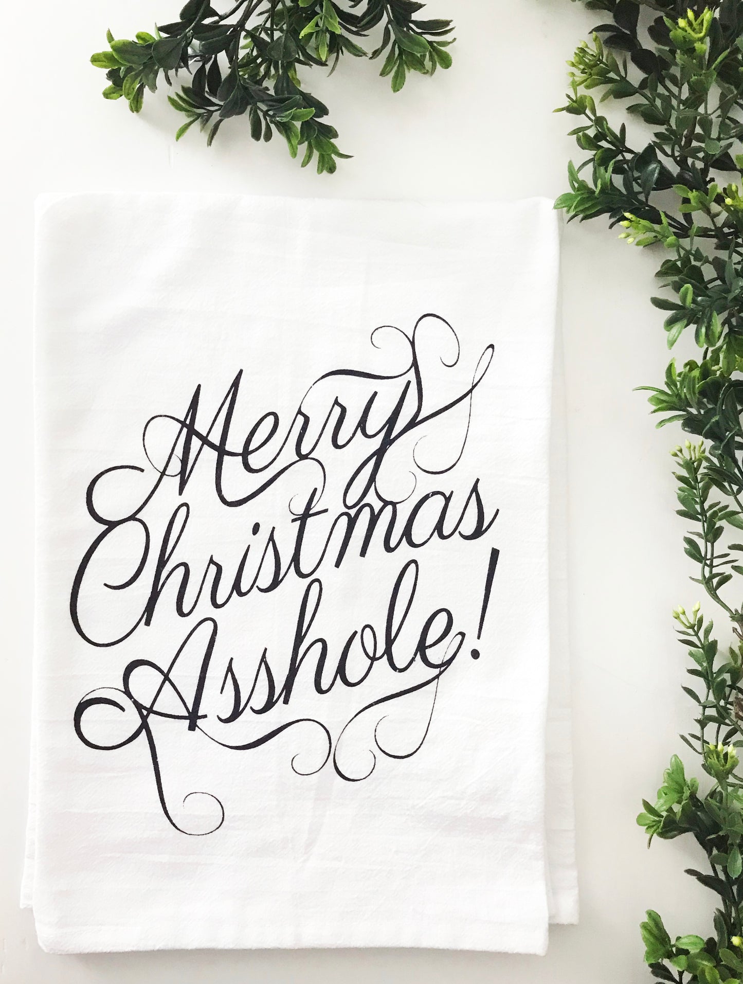 merry christmas asshole written in pretty cursive writing on cotton dish towel funny christmas home decor black and white screen print modern classic home decor coin laundry montana 