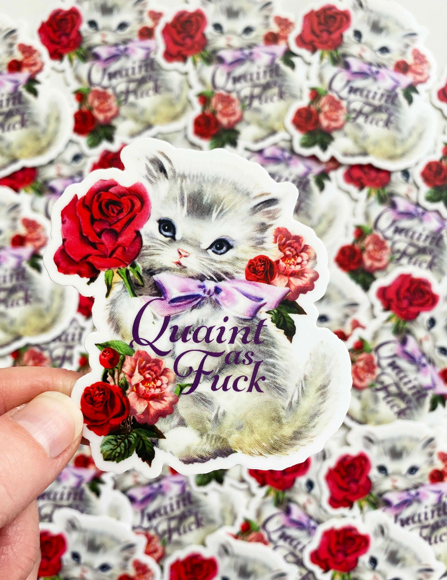 vintage white kitty with a purple bow and red roses funny phrase quaint as fuck cuss word cute sassy fancy adorable sticker